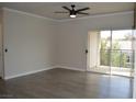 Open living room with sliding glass doors to private balcony at 2900 Sunridge Heights Pkwy # 1733, Henderson, NV 89052