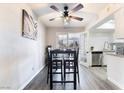 Charming dining area with modern furniture, a ceiling fan, and sliding glass doors at 3120 S Eastern Ave # 6, Las Vegas, NV 89169