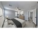 Serene bedroom featuring plush carpeting, a ceiling fan, and ample natural light at 3696 Via Geneva, Henderson, NV 89052