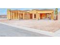 New home construction exterior displaying open framing, offering a glimpse into customizable modern living at 54 Bellissima Lago Ct, Henderson, NV 89011