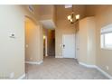 Spacious entryway featuring tile flooring and a view of the staircase at 5676 Bettors Luck Ct, Las Vegas, NV 89122