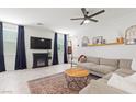 Cozy living room with stylish decor, comfortable seating, and a decorative fireplace at 6848 Calvitero St, Las Vegas, NV 89149