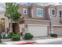 Multi-level home featuring neutral paint, well maintained landscaping, and attached two car garage at 689 Principle Point Ave, Henderson, NV 89012