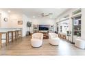 Bright living room with large windows and comfortable seating at 7307 Grace Estate Ave, Las Vegas, NV 89113
