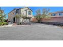 Comfortable home with desert landscaping, a brick driveway, and a two-car garage at 7870 Formitch Ct, Las Vegas, NV 89166