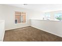 Neutral bedroom with carpet floor and a window with blinds at 7941 Limestone Arch Ave, Las Vegas, NV 89178