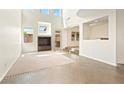 Bright, spacious living room featuring tile flooring, a custom built-in, and abundant natural light at 7941 Limestone Arch Ave, Las Vegas, NV 89178