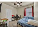 Comfortable bedroom featuring a ceiling fan, and natural light at 8421 Cheerful Brook Ave, Las Vegas, NV 89143