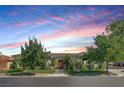 Well-maintained single story home with lush landscaping, mature trees, and charming curb appeal at 10969 Tranquil Waters Ct, Las Vegas, NV 89135