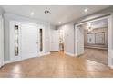 Inviting foyer with tile flooring, a decorative door, and an entrance to a bathroom at 10993 Ladyburn Ct, Las Vegas, NV 89141