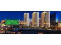 Beautiful nighttime view of a vibrant city skyline featuring the MGM Grand and several high-rise buildings at 125 E Harmon Ave # 2814/2816, Las Vegas, NV 89109