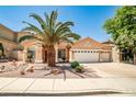 Charming single-story home with a three-car garage and desert landscaping at 1742 Sand Storm Dr, Henderson, NV 89074