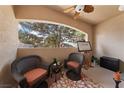 Cozy covered patio with comfortable seating and view of the trees at 2050 W Warm Springs Rd # 2822, Henderson, NV 89014