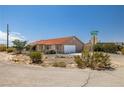 Inviting single-Gathering home on a corner lot with desert landscaping and a spacious two-car garage at 2090 S Ambush St, Pahrump, NV 89048