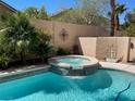 Inviting backyard pool and spa area, perfect for relaxation and entertaining at 2559 Purple Heather Pl, Henderson, NV 89052