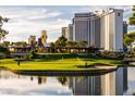 Scenic view of the golf course with lush green fairways, water features, and well-maintained landscape at 2857 Queens Courtyard Dr, Las Vegas, NV 89109