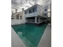 Back of house featuring a refreshing in-ground pool for relaxation and recreation at 2857 Queens Courtyard Dr, Las Vegas, NV 89109