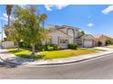 Charming single-Gathering house featuring a well-kept yard, mature shade trees, and a two-car garage at 313 Firestone Dr, Las Vegas, NV 89145