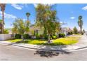 Beautiful home with a well-maintained lawn, mature trees, and lush greenery in a serene neighborhood at 313 Firestone Dr, Las Vegas, NV 89145