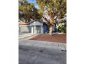 Attractive home with a two-car garage and beautifully landscaped front yard at 3704 Blairmoor St, North Las Vegas, NV 89032