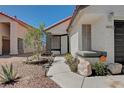 Charming single-story home featuring a delightful walkway and desert landscaping at 4052 Compass Rose Way, Las Vegas, NV 89108