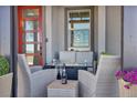 Cozy front porch with seating, a fire pit, and a champagne set at 460 Pear Lake St, Las Vegas, NV 89138