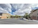 Gated community entrance with well-maintained landscaping and sidewalks at 6247 Milford Sound St, Las Vegas, NV 89148