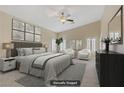 Spacious main bedroom featuring neutral colors, large windows with plantation shutters, and a ceiling fan at 8125 Turbys Treehouse Pl, Las Vegas, NV 89131