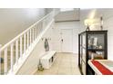 Welcoming foyer with a staircase, shiplap accent wall, and functional storage solutions at 8137 Crushed Velvet Pl, Las Vegas, NV 89166