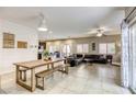 Bright living space with tile floors, modern furnishings, and access to the backyard patio at 8137 Crushed Velvet Pl, Las Vegas, NV 89166