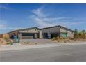 Stunning single-story home boasting a modern design, xeriscaping, and convenient two-car garage at 8310 W Camero Ave, Las Vegas, NV 89113