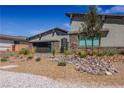Charming single-story home with modern design, stylish landscaping, and attached two-car garage at 8310 W Camero Ave, Las Vegas, NV 89113