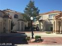 Charming neighborhood featuring well-maintained homes with red tile roofs and landscaped front yards at 8829 Cornwall Glen Ave, Las Vegas, NV 89129