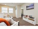 Upstairs loft area filled with natural light and neutral carpet at 8929 Sleepy Panda Ave, Las Vegas, NV 89148