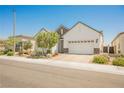 Attractive single-story home with desert landscaping and two-car garage at 8968 Skye Treeline St, Las Vegas, NV 89166