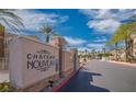 Inviting entrance to the 'Chateau Nouveau' community features lush landscaping and a welcoming atmosphere at 10001 Peace Way # 1341, Las Vegas, NV 89147