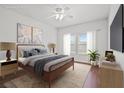 Cozy bedroom with natural light, stylish decor, and a comfortable queen-sized bed at 10809 Garden Mist Dr # 1004, Las Vegas, NV 89135
