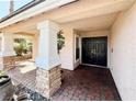 Welcoming front entrance with double doors, columns, and brick paver landing at 1105 Enderly Ln, Las Vegas, NV 89144