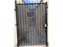Metal security gate with bars for privacy and safety at 1203 Mews Ln, Las Vegas, NV 89101