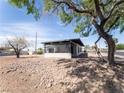 Exterior view of single-story home with modern carport and rock landscaping at 170 Copper St, Henderson, NV 89015