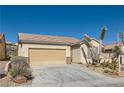 Charming single-story home with a two-car garage, desert landscaping, and sidewalk at 2167 Shadow Canyon Dr, Henderson, NV 89044