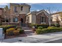 Charming exterior showcasing stone accents, manicured landscaping, and inviting curb appeal, making a great first impression at 2215 Alcova Ridge Dr, Las Vegas, NV 89135