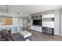 Contemporary living area with breakfast bar, modern furnishings, built-in storage, and adjacent desk area at 222 Karen Ave # 3104, Las Vegas, NV 89109