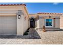 Inviting front entrance with stone walkway leading to the decorative front door and desert landscaping at 2305 Hot Oak Ridge St, Las Vegas, NV 89134