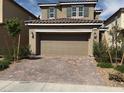 Charming two-story home featuring a two-car garage and a well-maintained, low-water, desert landscaped front yard at 2321 Teatro Ave, Henderson, NV 89044