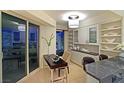 Cozy dining area with city views, built-in shelving, and modern lighting at 2747 Paradise Rd # 1703, Las Vegas, NV 89109