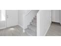 A modern entryway features neutral-colored walls and tile floors plus stairs at 3314 Villa Fiori Ave, Las Vegas, NV 89141