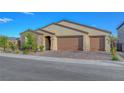 Lovely one-story home featuring a three-car garage and inviting curb appeal at 3495 Luca Point Ave, Henderson, NV 89044