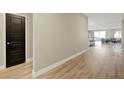 Spacious hallway with wood floors leading to an open-concept living area at 3495 Luca Point Ave, Henderson, NV 89044