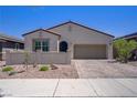 Charming single-story home featuring a two-car garage, desert landscaping, and a private gated courtyard at 390 Inflection St, Henderson, NV 89011